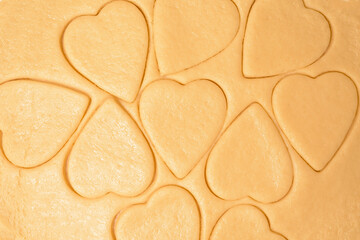dough for heart cookies for Valentine's day, ingredients for baking for the holiday. decorative hearts top view