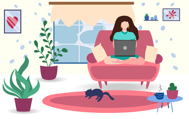 A woman works on a laptop at home on the couch. Freelance concept, quarantine due to covid-19