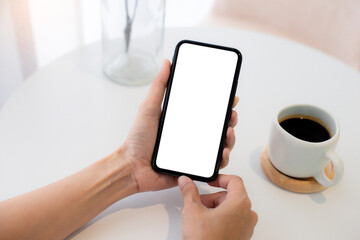 cell phone blank white screen mockup.woman hand holding texting using mobile on desk at office.background empty space for advertise.work people contact marketing business,technology