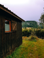 Small wooden cabin in nature.