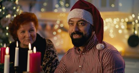 Man with family members on Christmas dinner
