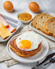 Croque madame delicious french breakfast with ham, cheese, mustard and eggs