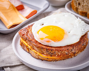 Croque madame delicious french breakfast with ham, cheese, mustard and eggs