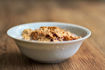 Cereals or cornflakes  stand on the table. Breakfast meal.