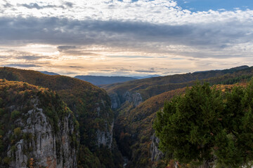 Fototapeta premium vikos gorge on Tymfi mountain with fall colors near tsepelovo in Zagori Epirus, Greece.