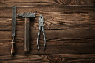 Set of tools over a wood panel. Collection of vintage tools.