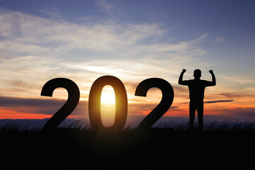 Silhouette freedom businessman happy with New year 2021