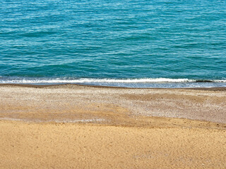 Blue sea wave on clean coast with sandy beach