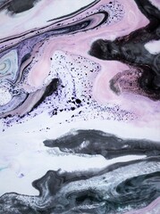 Pink-gray-white marble background. Acrylic paint flows freely and creates an interesting pattern....