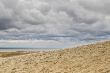 Fototapeta na wymiar Dead Dunes in Nida with cloudy sky, Curonian Spit, Lithuania