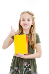 Homework is easy! Sweet and cute reader girl shows ok sign holding multicolored books in hands. Isolated on white background
