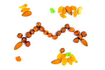 Nuts, almonds and candied fruits on a white background