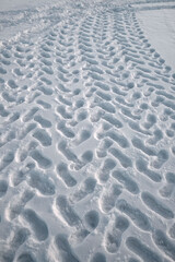 Fototapeta premium Winter snow. Abstract pattern, traces of human feet. Background image.