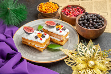 front view yummy waffle cakes with fresh fruits on dark background sweet cake photo cream sugar dessert