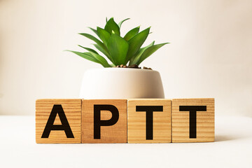 wooden cubes with text APTT. the medicine. medical concept