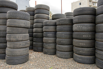 Stack of old used car tires on the ground
