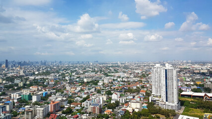 Fototapeta premium top view a city. Aerial city view from at Bangna, Thailand.