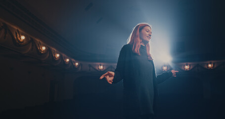Young actress reading script with director