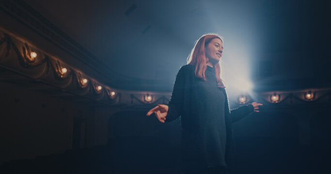 Young actress reading script with director