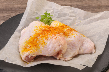 Raw chicken thigh with spices