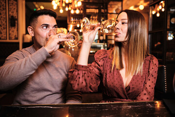 Couple having a date and drinking wine at restaurant.