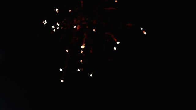 Golden Fireworks with particles and sparks in the black night sky. For 4th of July, festival, Anniversary, Celebration, Party, New Year, Happy Birthday, Wedding, Confetti, Diwali, Christmas
