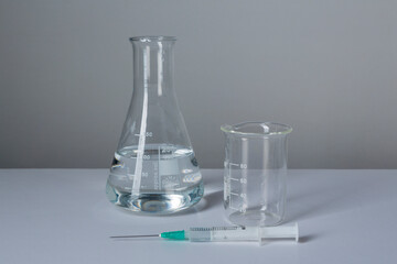 Coronavirus vaccine calendar with syringe on white background