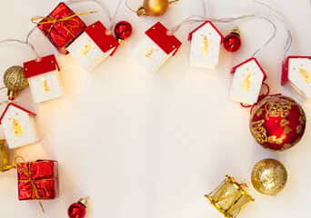 Christmas frame. Christmas balls, garlands, red and gold decorations on a white background. Flat lay, top view, copy space
