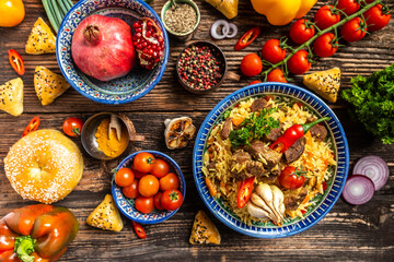 Uzbek and Central Asia cuisine concept. Assorted Uzbek food pilaf samsa lagman manti shurpa Uzbek restaurant concept Uzbek food. Food recipe background.