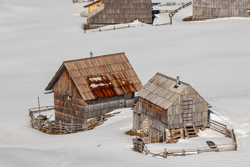Fototapeta na wymiar Mountain huts covered in snow, Laz 