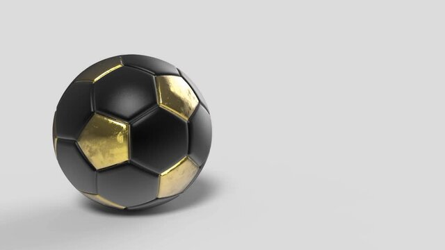Golden yellow and black soccer ball that turns on itself on isolated white background. High quality 3d render illustration for football