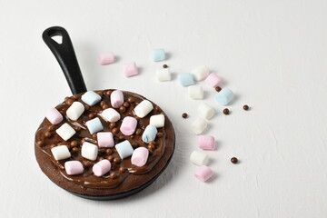skillet cookie topped with marshmallows 