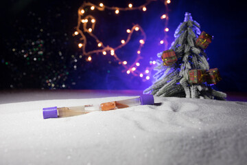 Traditional holiday attributes on snow. Creative artwork decorations. Empty space for your text