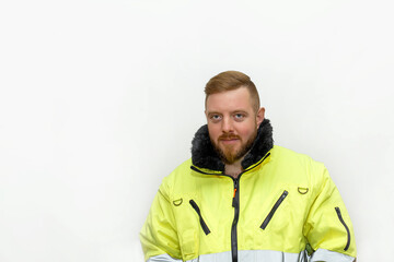 Male industrial worker in winter clothes. Bearded engineer on white background.