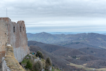 Fototapeta na wymiar Men in Cathar castle of Montsegur in Ariege, Occitanie in south of France in winter 2020