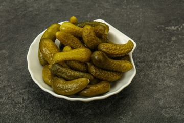 Pickled gherkin in the bowl