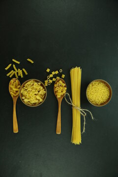 ingredients for homemade pasta. Food background: macaroni, spagetti, egg, flour