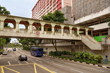  Pedestrians and cars are moving along the streets of the city