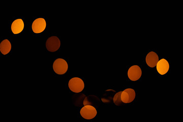 Texture of blurred bokeh colorful lights on black background