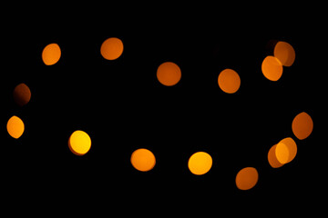 Texture of blurred bokeh colorful lights on black background