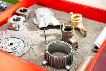 many kind of casting product show before and after cleaning by shot blasting process and put it on steel ball in box such as automobile part etc.