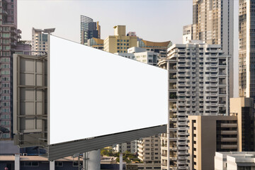 Obraz premium Blank white road billboard with Bangkok cityscape background at day time. Street advertising poster, mock up, 3D rendering. Side view. The concept of marketing communication to promote or sell idea.
