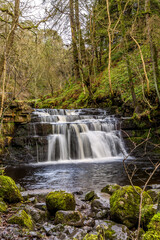 Fototapeta na wymiar Ash Gill near Alston in Cumbria, is located in an area of outstanding natural beauty close to the Lake District National Park, is a beautiful stretch of water with many picturesque waterfalls