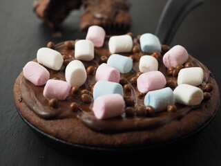 chocolate brownie cooked in a cast iron skillet 