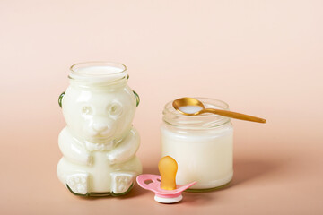 Baby feeds on MOM's breasts