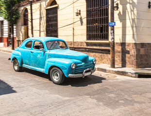 classic car on the street in santiago de cuba, cuba