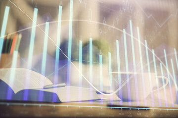 Multi exposure of forex graph drawing and desktop with coffee and items on table background. Concept of financial market trading