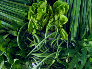 Fototapeta premium Background of fresh green vegetables and herbs. Top view.