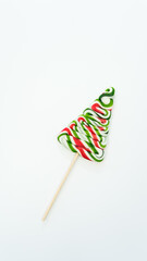 Christmas tree in the form of Christmas candies on a stick on a white background.