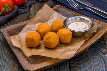 fried Cheese balls on wooden table